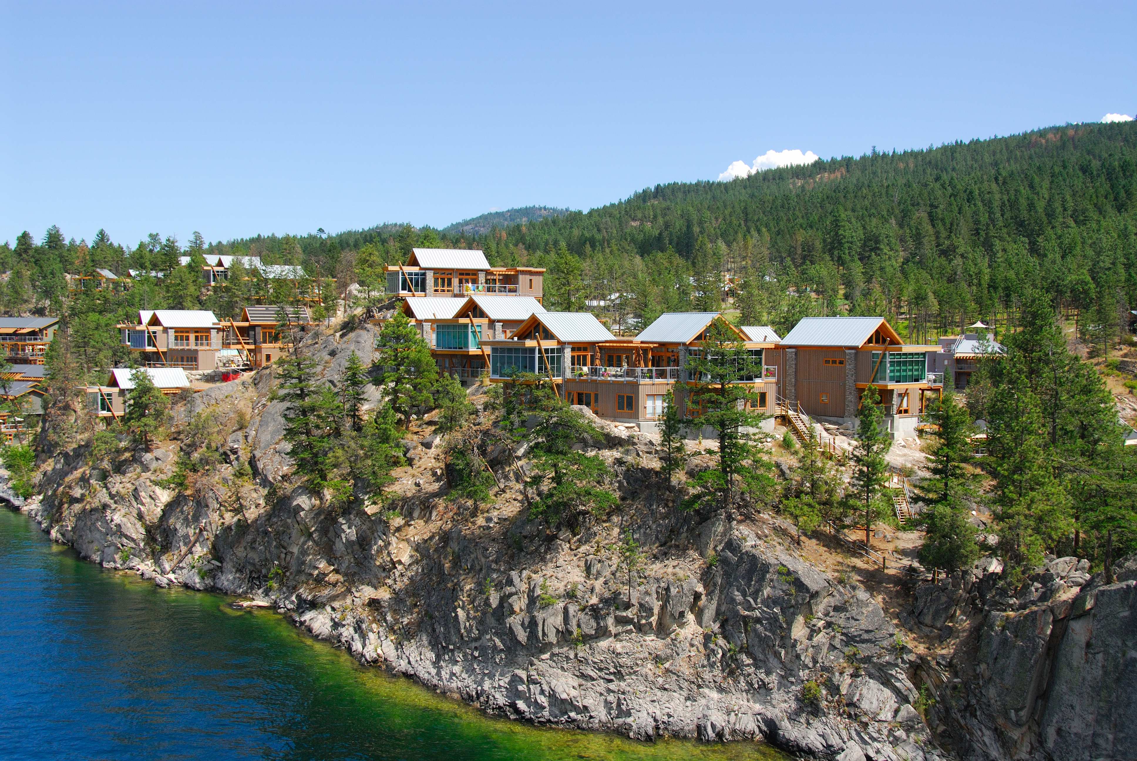 Cabins on a granite bluff above Okanagan Lake at The Outback