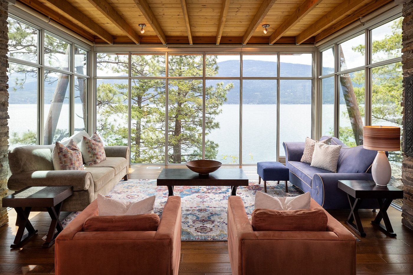 Living room with floor to ceiling windows onto the lake